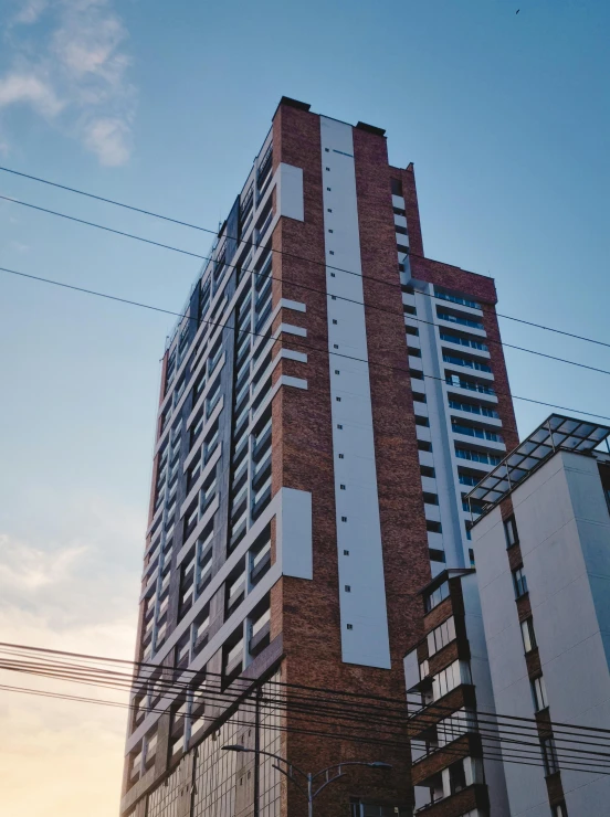 an apartment building in the city at sunset