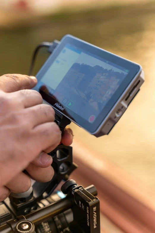 a man that is holding a camera up to take a po