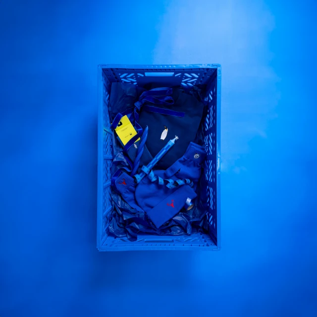 the blue box contains a blue tie and a pocket