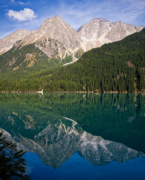 mountains are seen near the water on this beautiful day