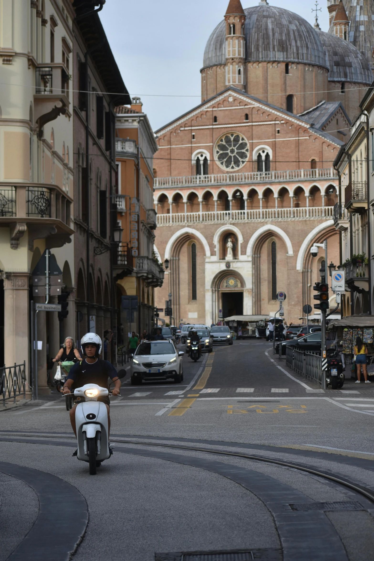 a man riding a motorcycle down a road