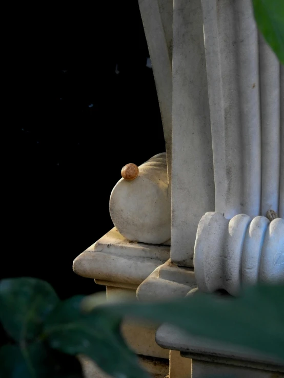 three white statues sitting next to each other