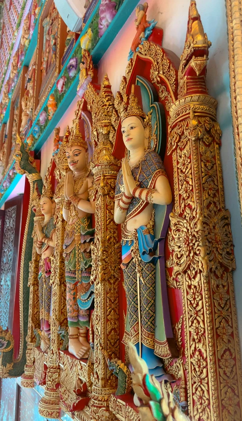 sculptures on the walls of temples, in thailand