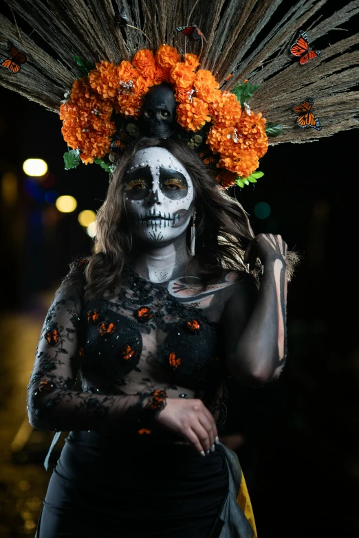 a woman with makeup and flowers painted on her head