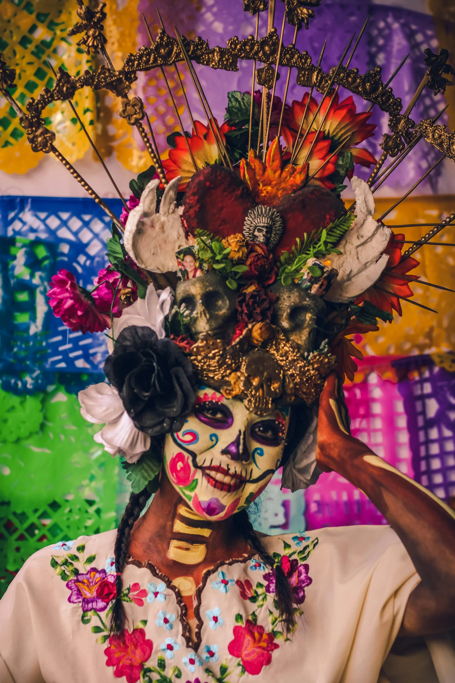 a woman with colored flowers painted on her face