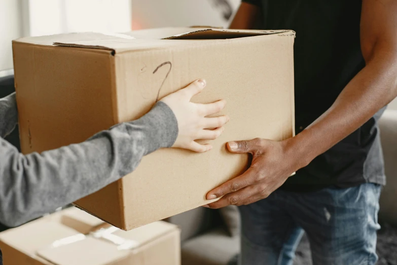 an image of someone is giving someone a box