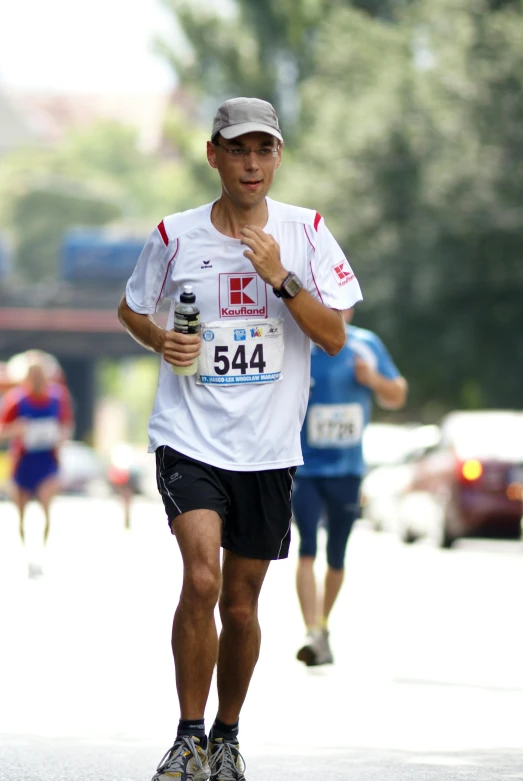 a runner in a race is making an early lap