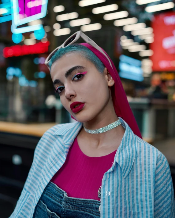 a young woman with her tongue hanging out and makeup on