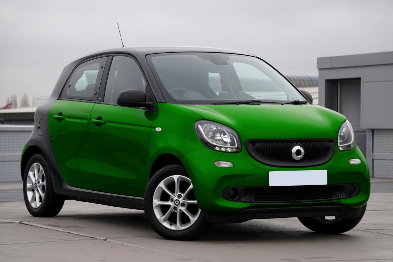 a bright green car on a street with buildings in the background