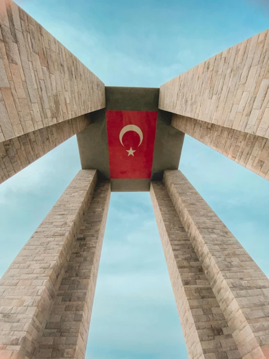 a square structure with a flag of turkey at the top of it