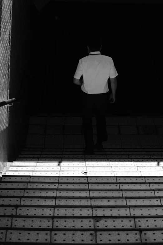 a person standing in the back of a building