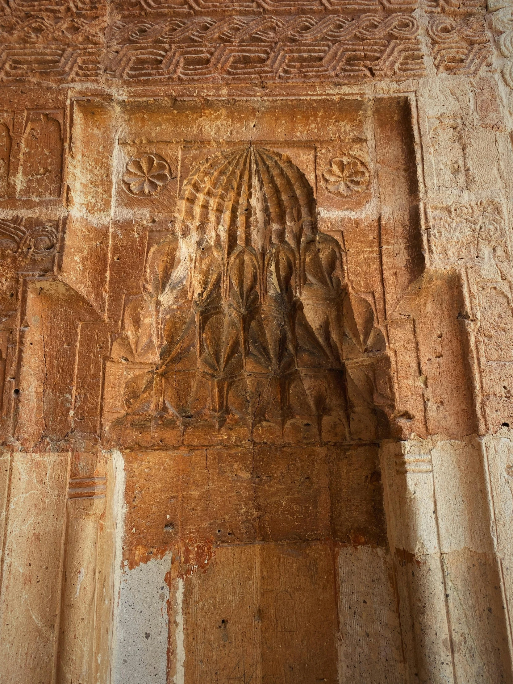 the carvings are in a large brick wall