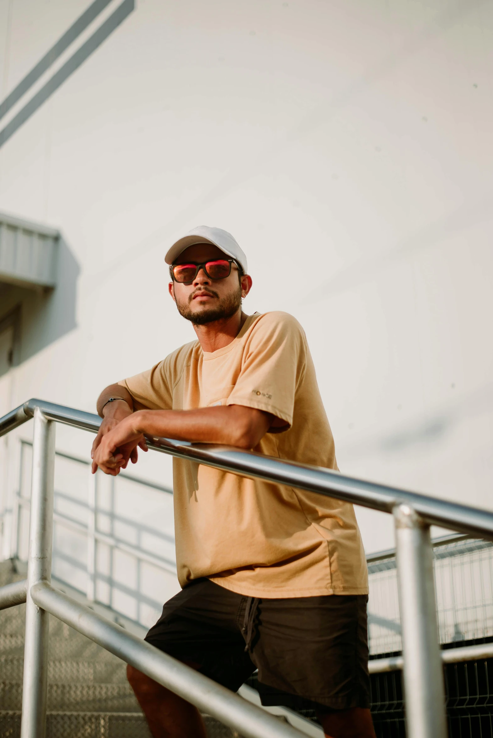 a person standing at the top of a railing