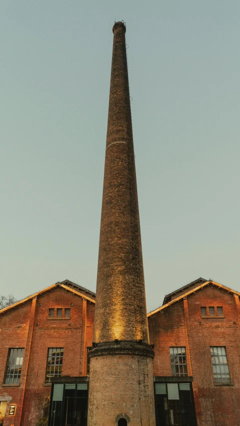 a tall tower sitting inside of a building with lots of windows