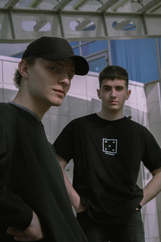 a few boys are standing in front of a building