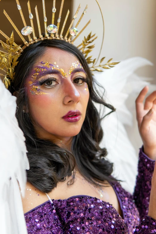 a woman in a costume with feathers on her head