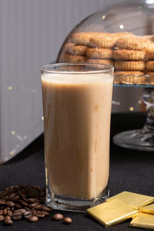 a beverage glass that has some cookies in it