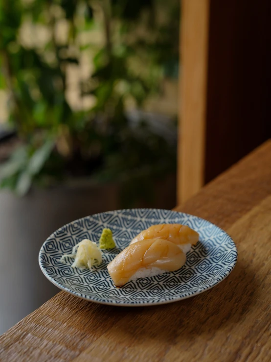 a fish on a plate with garnish and condiments