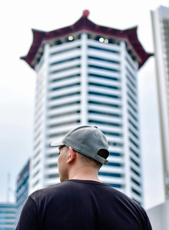 a man that is standing in front of a building