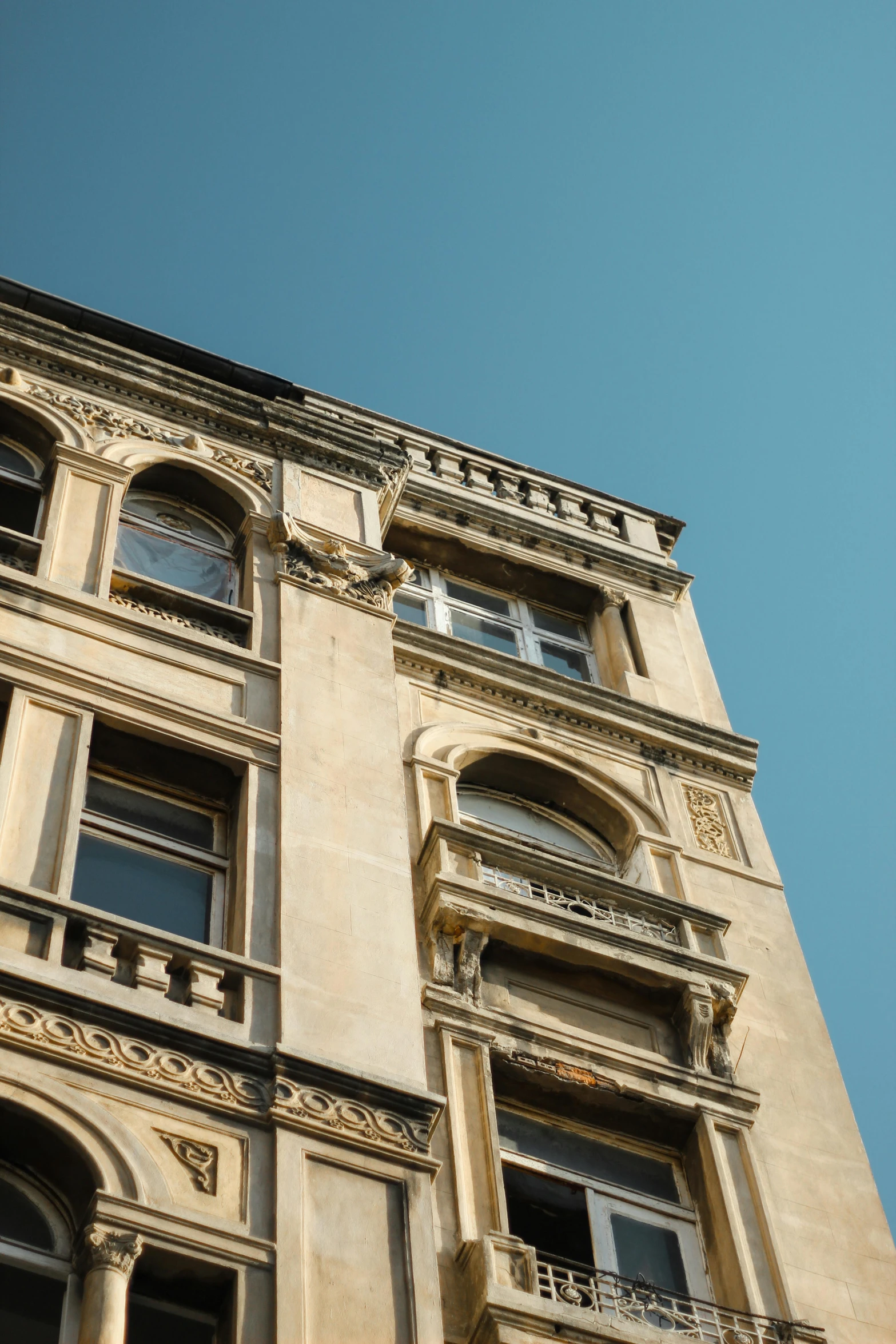 the sky is blue over a building with windows