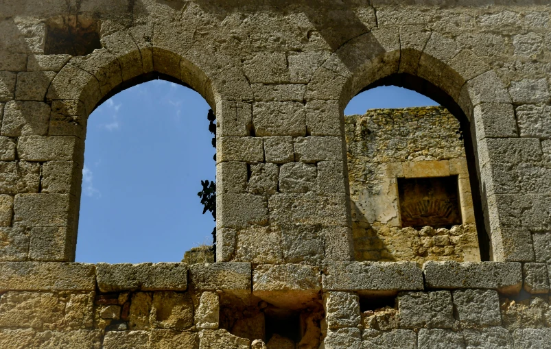 a window with three windows on the side of it