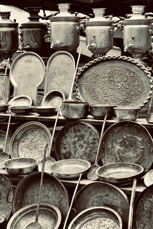 black and white pograph of old - fashioned dishware in black and white