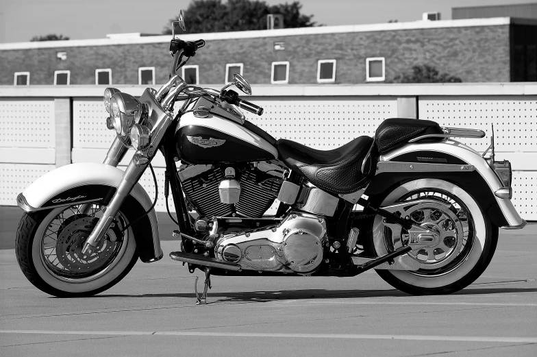 a very well dressed and well lit motorcycle parked near a wall