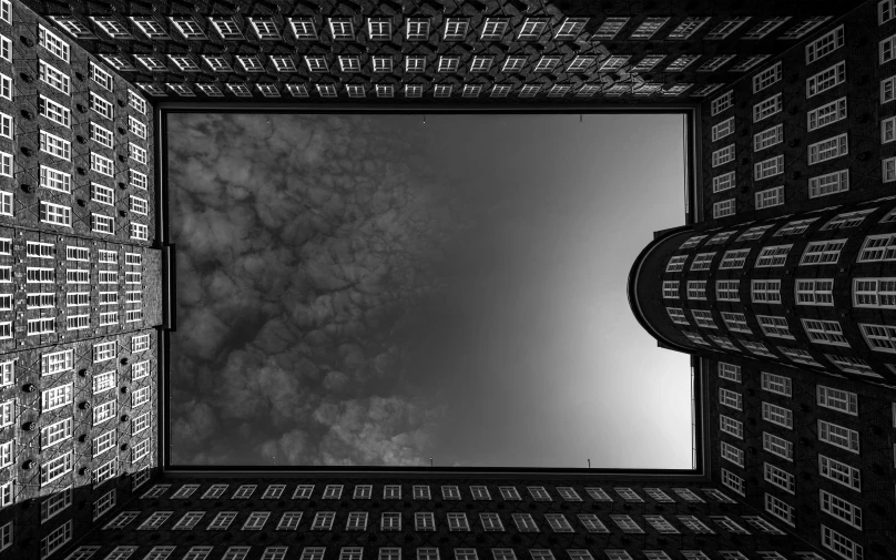 looking up at the ceiling of a building under clouds