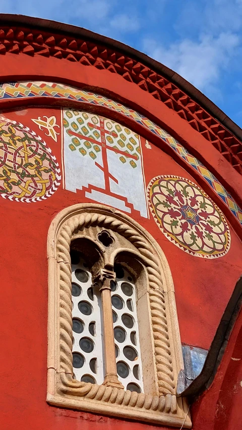 the wall is painted in orange, red and white