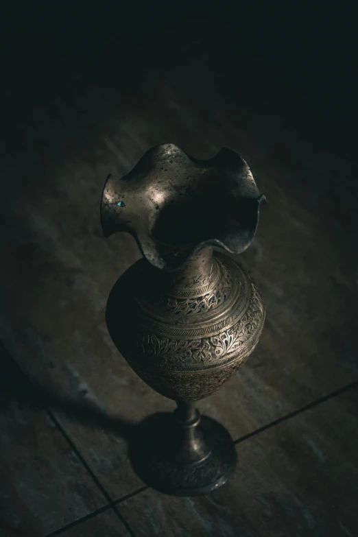 black and white image of an oriental vase with handles