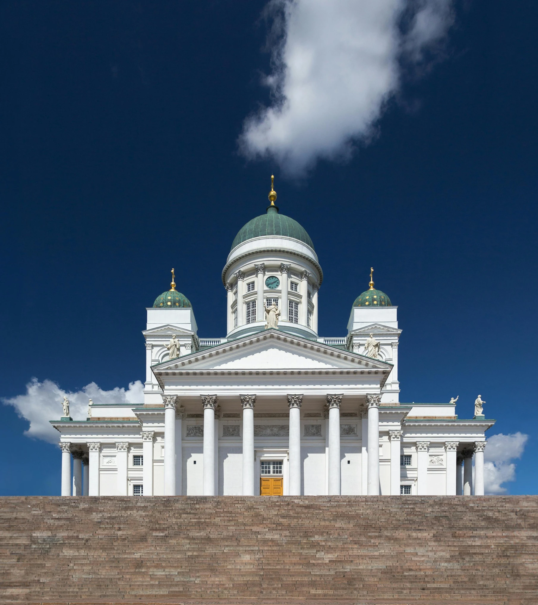 large white building with a big clock on the top