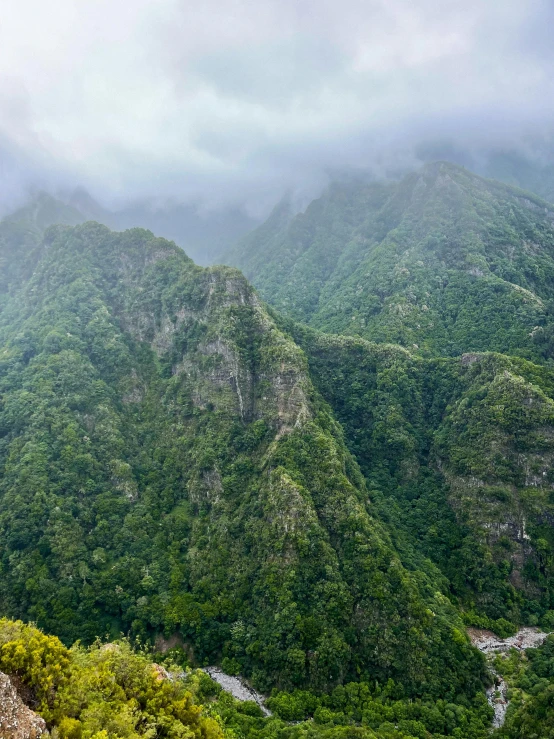 many mountains in the background are covered in fog