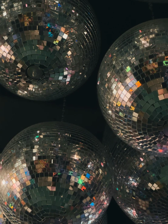 several disco balls are stacked on top of each other