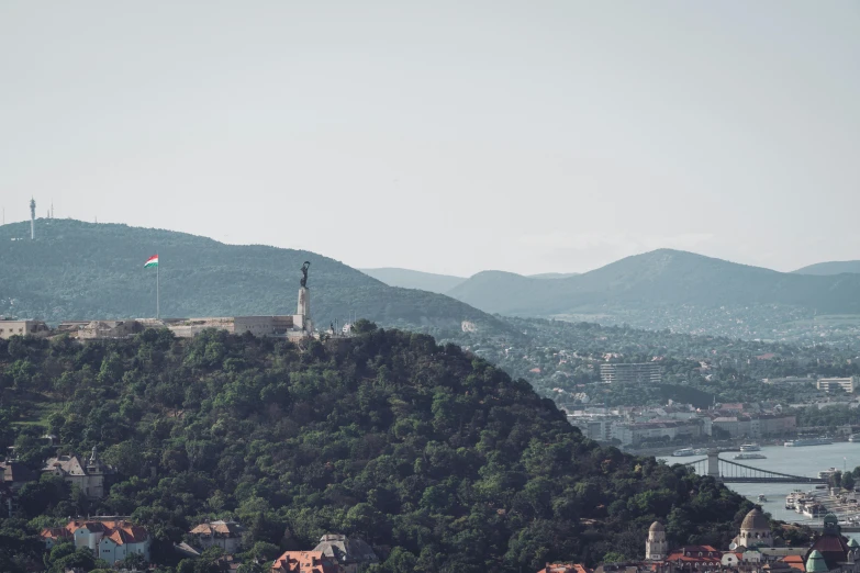 a long mountain with a tall hill next to it