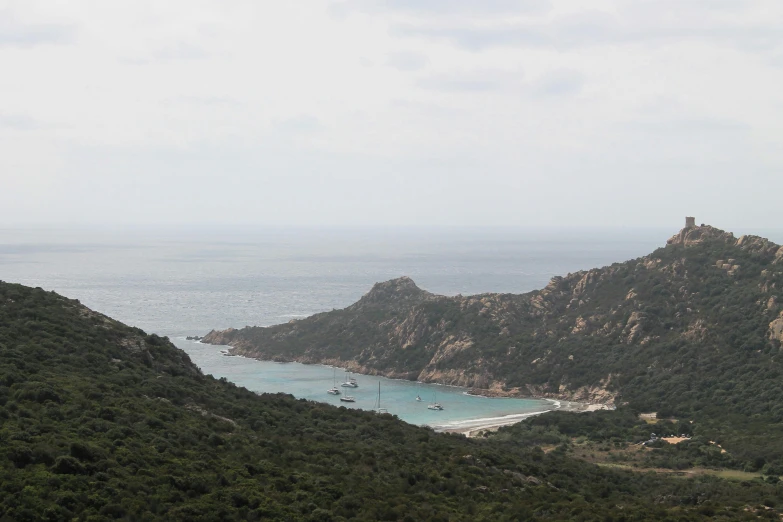 two boats anchored at the shoreline on the waters