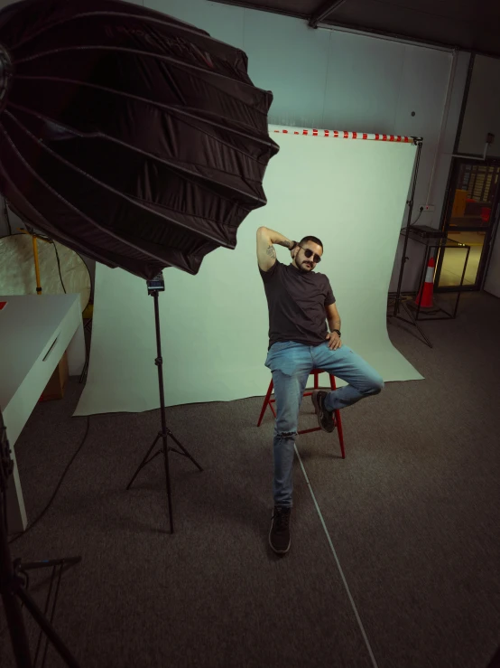 a man is sitting in front of a white board