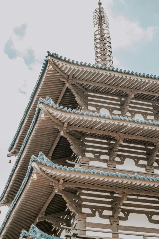 the roof of a large wooden structure with many blue and white patterns on it