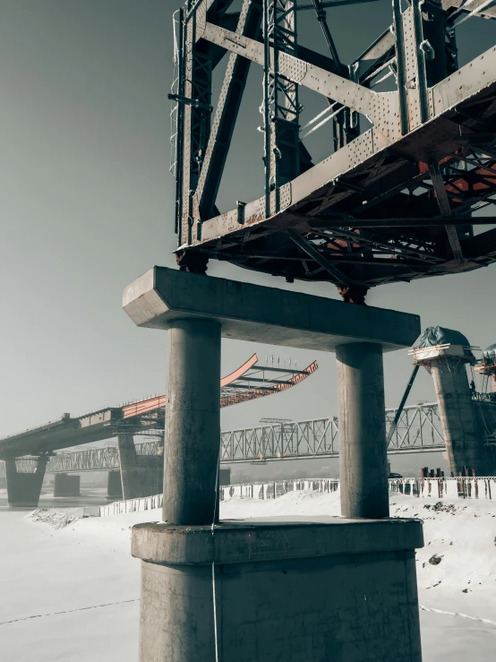 an old steel railway track going over a bridge