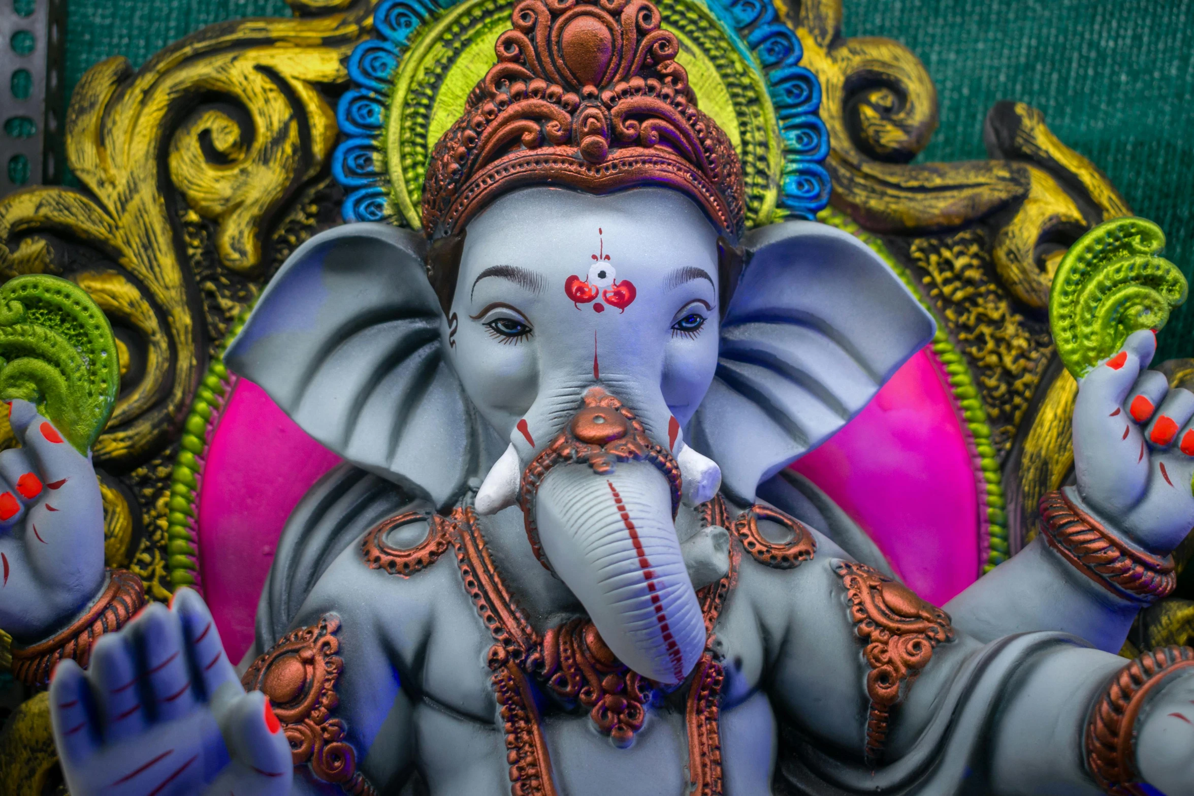 an ornately painted statue of a small elephant