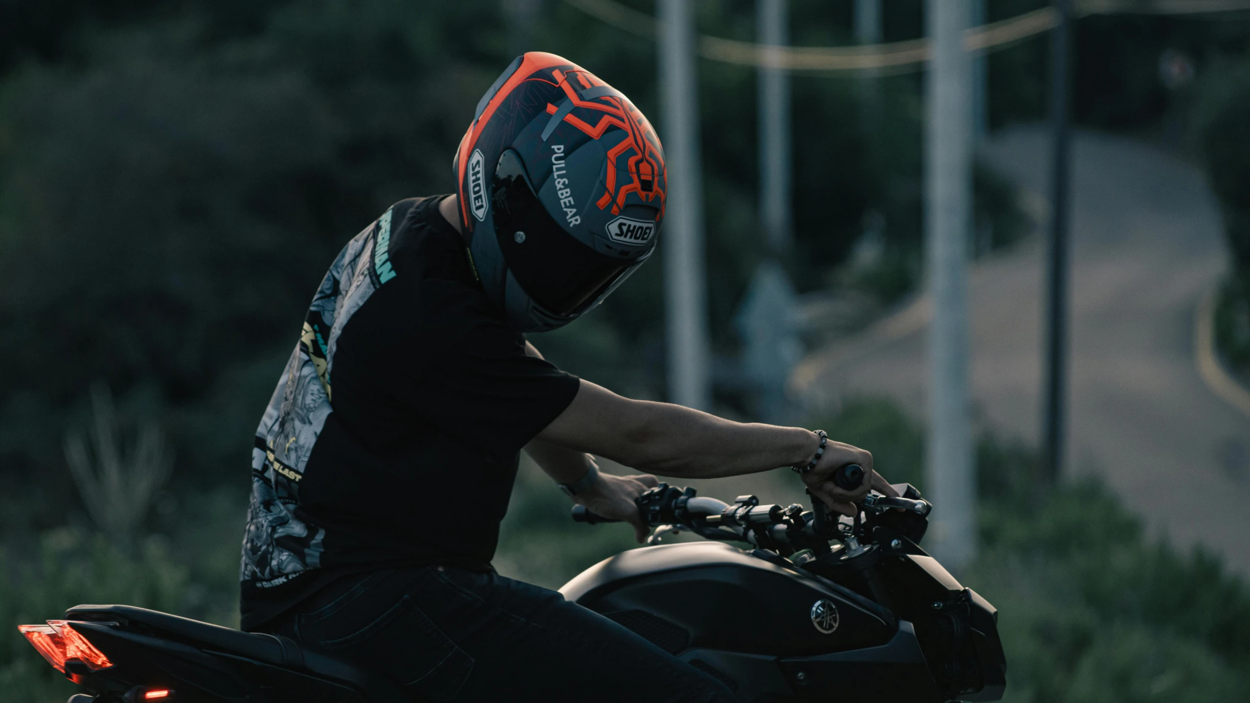 a person is riding a motorcycle through the street