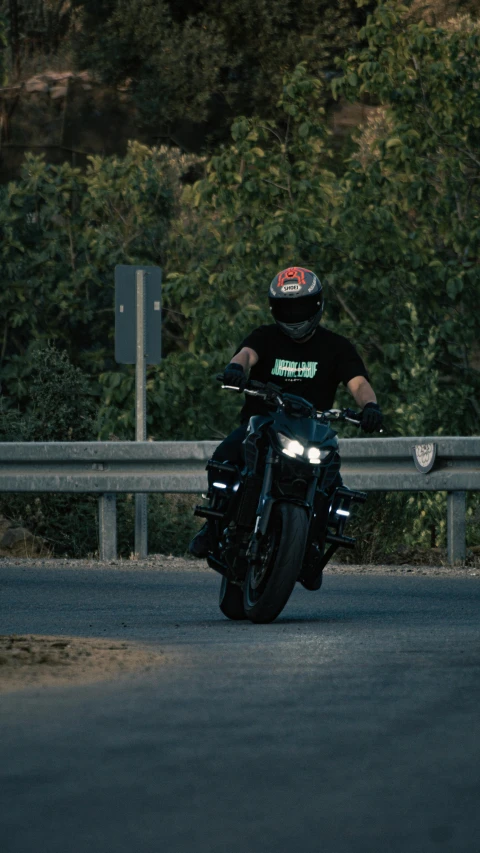 a man on his motor cycle turning the corner