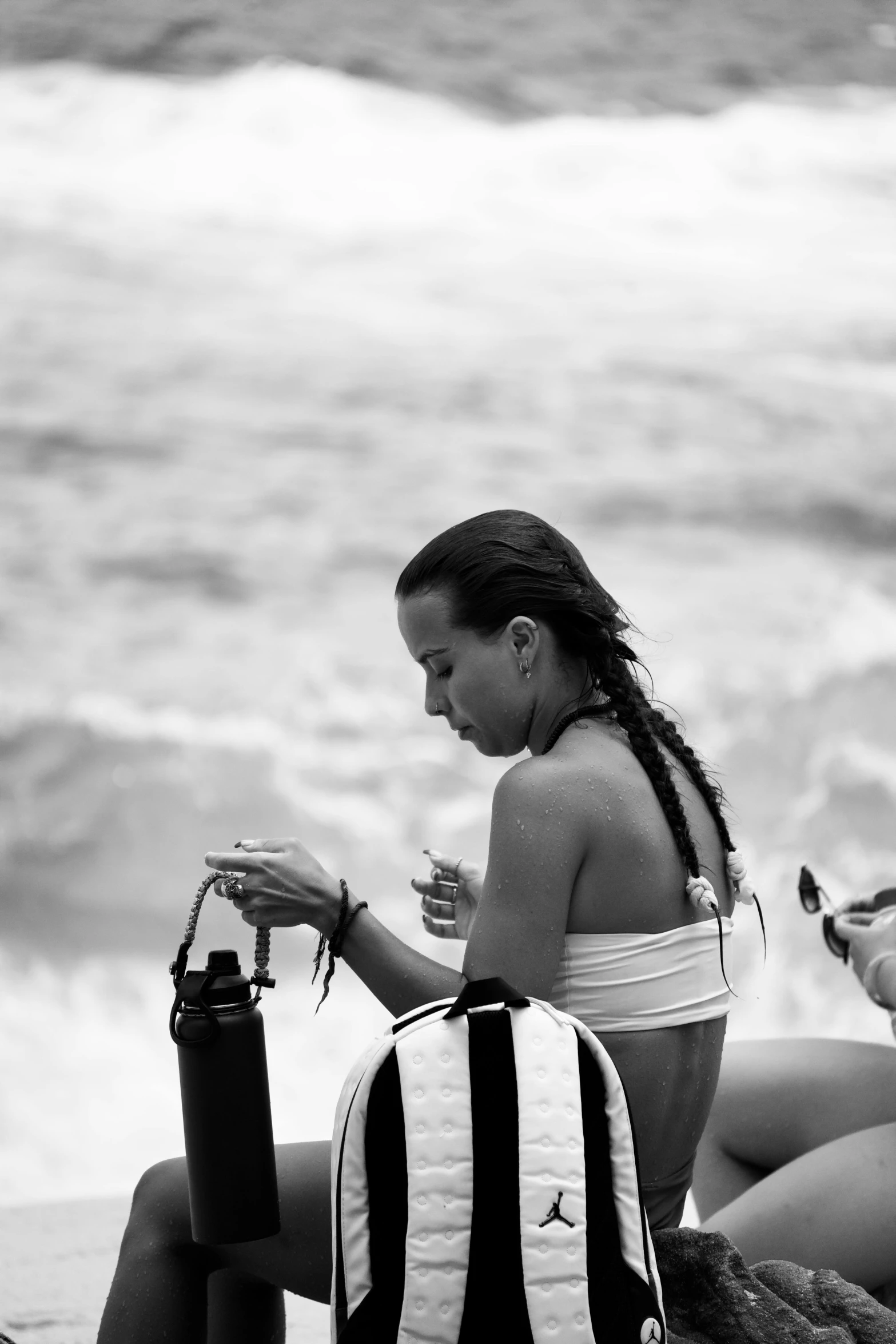 a person is sitting on the beach