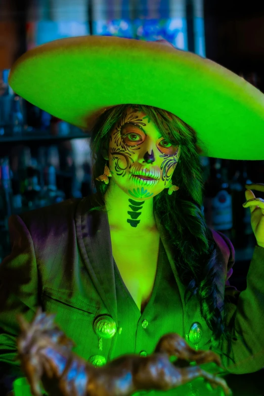 a mexican woman dressed as skeleton in green