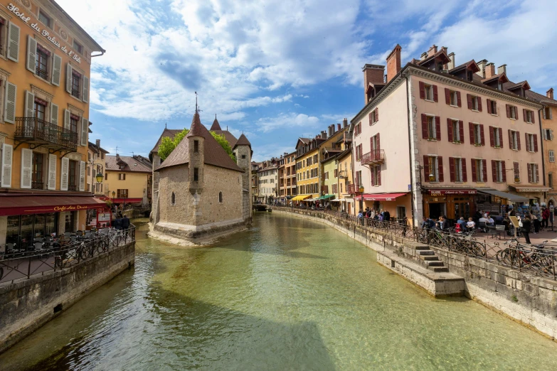 a couple of buildings next to a body of water