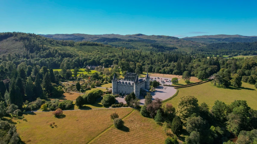 aerial view of a huge building in the middle of the forest