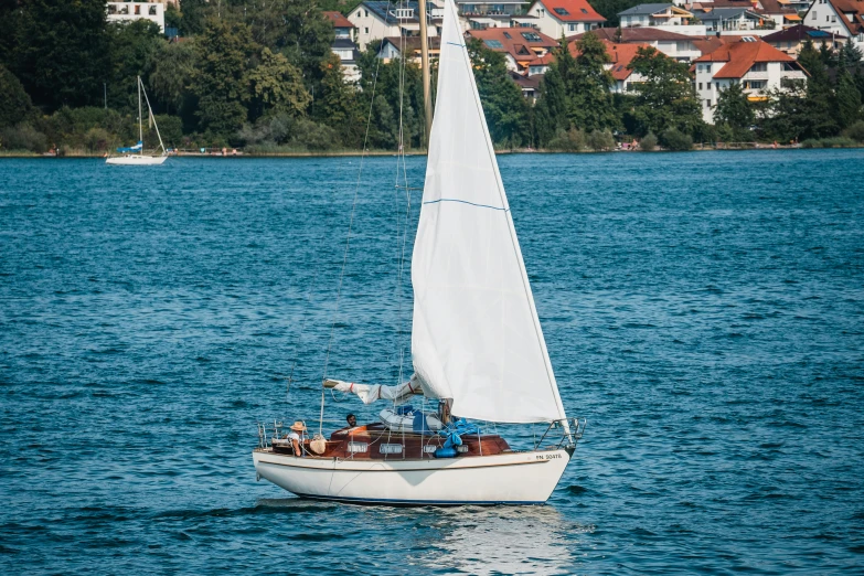 a boat sailing in the middle of a body of water