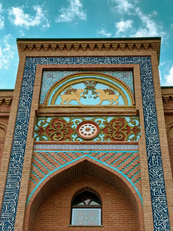 a clock built into the side of a red building