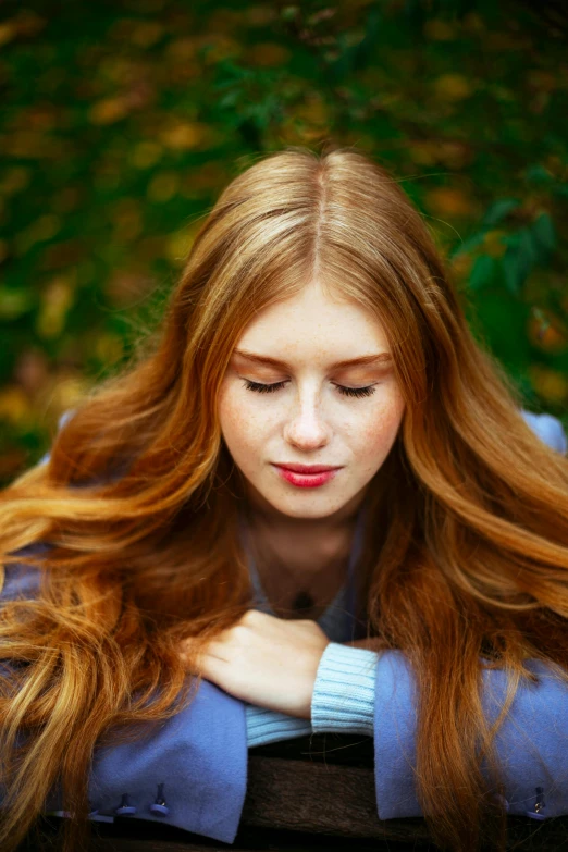 a pretty young lady with long blonde hair