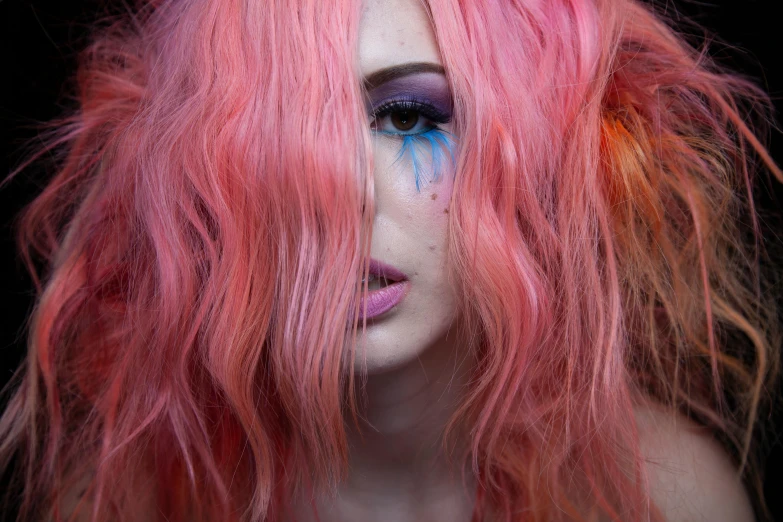 a woman with a pink wig and makeup with painted parts