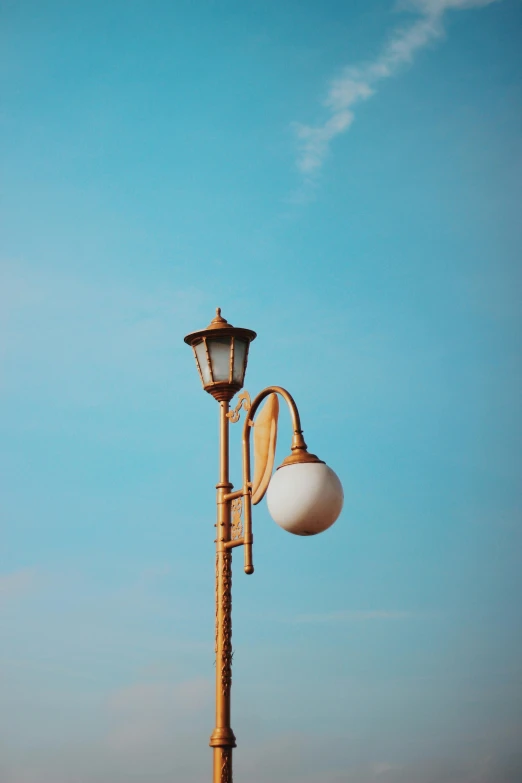 a street light with two street lamps attached to it